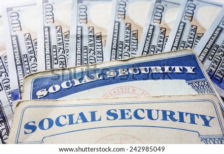 Social Security cards and hundred dollar bills