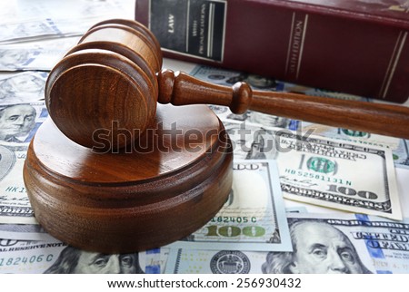 Legal gavel with cash and law book
