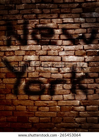 New York spray painted on a brick wall