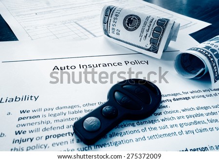 Auto insurance policy with cash and car key