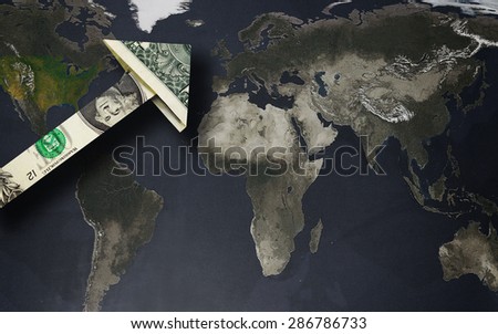 Up arrow dollar over a world map -- strong dollar or globalization concept