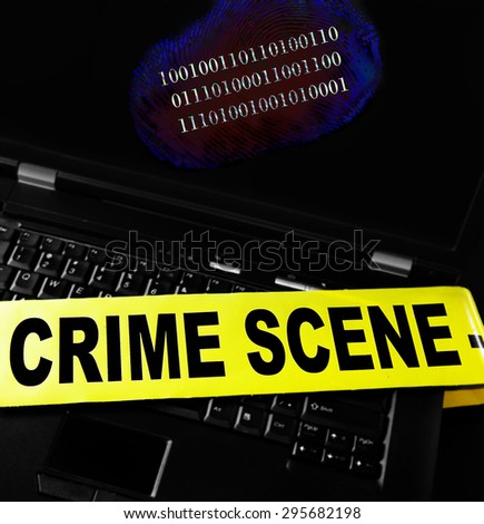 digital fingerprint on a laptop with crime scene tape