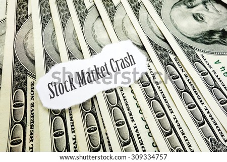 Stock Market Crash newspaper headline on hundred dollar bills