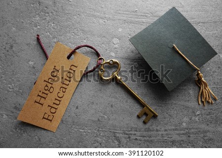 Higher Education key tag with graduation cap                                商業照片 © 