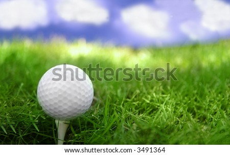 Golf ball on the tee and blue sky
