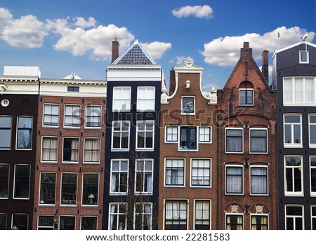 Row of houses and buildings along a canal in Amsterdam, the Netherlands