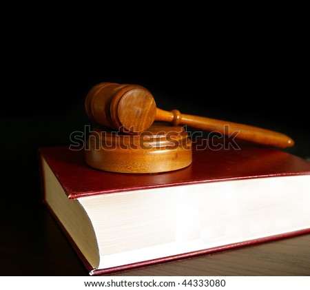 judges court gavel sitting on a law book
