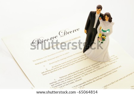cake-topper couple on a divorce agreement