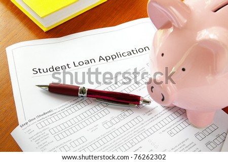 student loan application and piggy bank