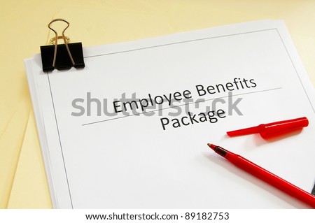 an employee benefits package and red pen