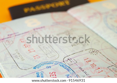 Closeup of US passport with international stamps