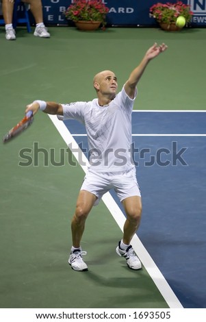 7-27-06 Los Angeles Countrywide Classic Tennis Tournament.  Andre Agassi serving at George Bastl in the second round
