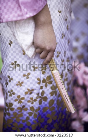 Close up on the fan held by a tradtional Japanese dancer.