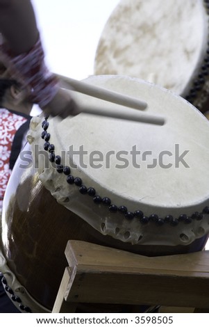 Drummers playing the Taiko Drums, a traditional Japanese instrument.