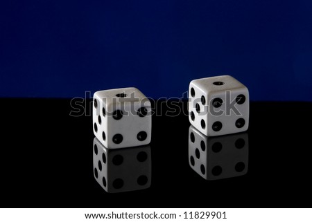 A pair of dice with a pair of ones showing, aka \