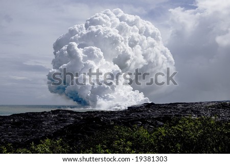 Steam cloud formed by the flow of Lava on Hawai'i from Mt. Kilauea.  The cloud approximates a mushroom cloud due to angle.