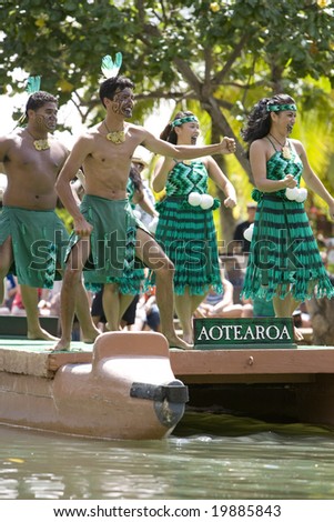 POLYNESIAN CULTURAL CENTER, OAHU, HI - JULY 26:  Students from New Zealand perform traditional Maori cultural dances on a canoe.   Taken at the Rainbows of Paradise Canoe Pageant in 2008.