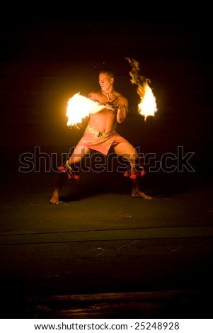 LA\'IE, HI - JULY 26: Students performing a fire dance at the Polynesian Cultural Center (PCC) in 2008. The PCC is Hawai\'i top paid attraction, and supports BYU students.