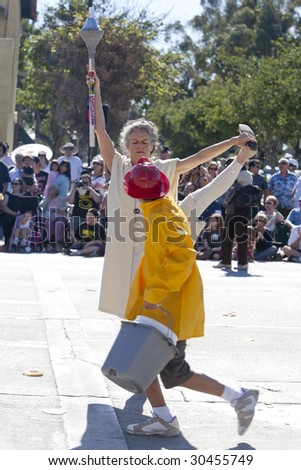 PASADENA, CA - JANUARY 18: Parade participant protests to Free Tibet while watched by a \