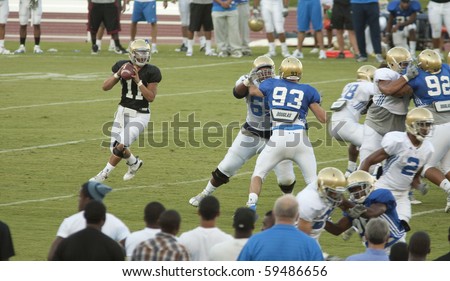 LOS ANGELES - AUGUST 21: UCLA Bruins scrimmage against each other on August 21, in Los Angeles. Quarterback Darius Bell, prepares to throw the ball.