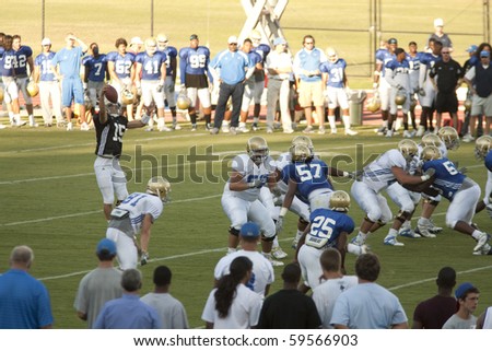 LOS ANGELES - AUGUST 21: UCLA Bruins scrimmage against each other on August 21, in Los Angeles.  Quarterback Justin Posthuma catches the snap.
