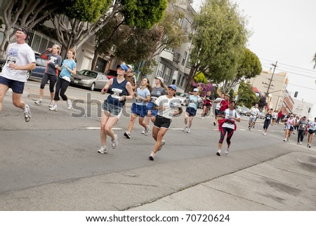 SAN FRANCISCO - JULY 25: Participants run in the San Francisco Marathon on July 25, 2009 in San Francisco, CA. The city\'s famous hills make for a challenging course.