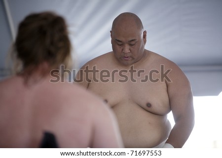 LOS ANGELES - APRIL 5:  Mark Reiman (L) and Americus Abesamis (R) face off at a Sumo wrestling demonstration at the Little Tokyo Cherry Blossom Festival on April 5th, 2009 in Los Angeles.