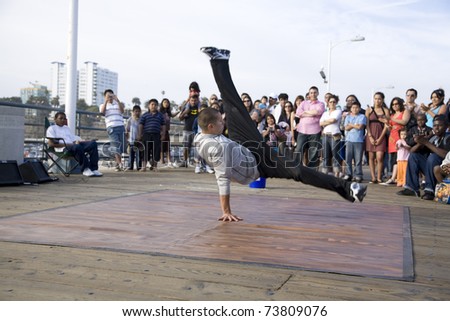 SANTA MONICA, CA - May 3, 2008:  B-Boy street performer break dances for the crowd on May 3, 2008 in Santa Monica, CA.