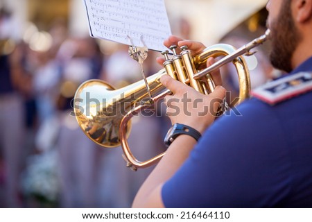 Man playing a trumpet during a concert.