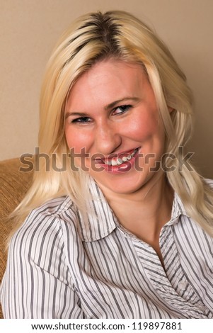 Tall young blonde in a striped blouse