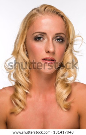 Portrait of a pretty young blonde in a tube top