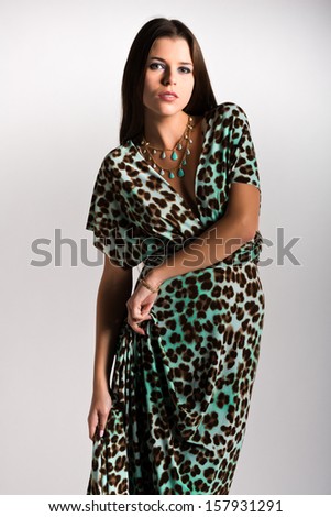 Beautiful slender Ukrainian woman in a leopard print dress