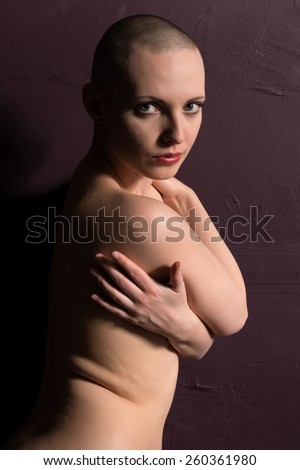 Pretty pale woman with a shaved head