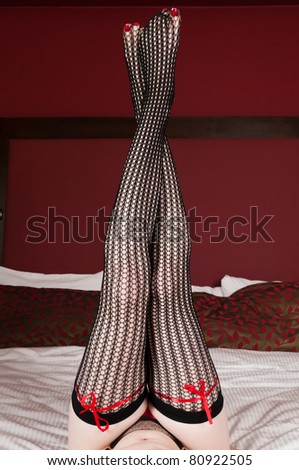 Long slender legs in crocheted stockings