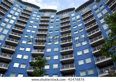 Modern British apartment / block of flats - blue, curved architecture