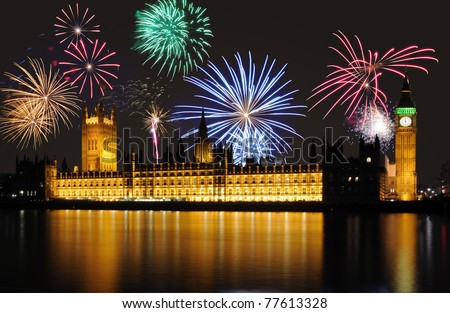 Clock shows midnight - fireworks above Big Ben / Parliament, London