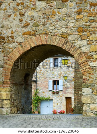 Stone arch in the ancient town Murlo, Italy