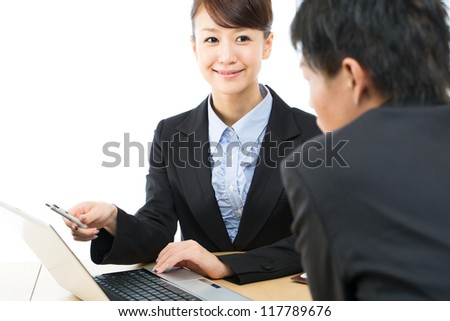 Young asian smiling businesswoman and businessman