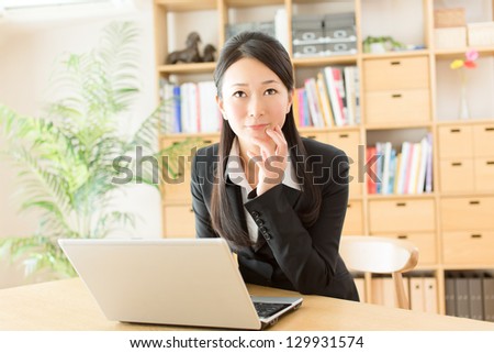 Beautiful asian businesswoman working in office