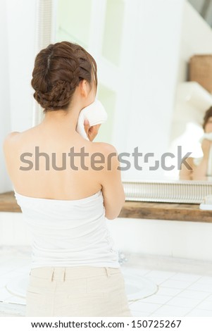 Beauty asian woman washing her face with clean water