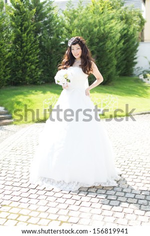 Beautiful asian woman in elegant wedding dress