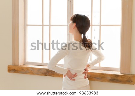 Beautiful young woman relaxing in the bedroom. Portrait of asian woman