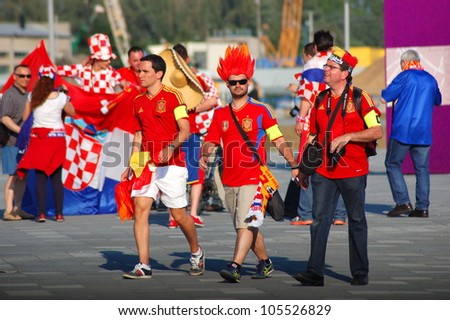 GDANSK, POLAND - JUNE 18: Spanish football fans on their way to EURO 2012 match Spain vs. Croatia on June 18, 2012 in Gdansk, Poland