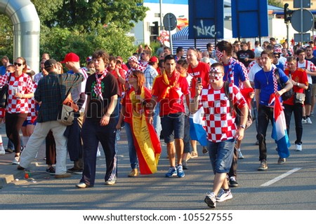 GDANSK, POLAND - JUNE 18: Spanish and Croatian football fans going to EURO 2012 match Spain vs. Croatia on June 18, 2012 in Gdansk, Poland