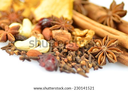 Christmas spices, nuts and dried fruits on white background