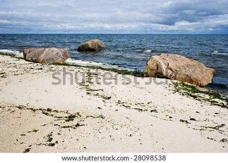 A view of sand,rocks,ocean and sky. Long Island Sound, Long Island, New York