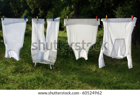 white laundry hanging outdoors