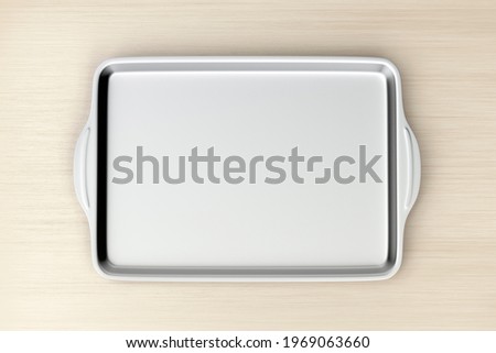 Stainless steel baking pan on wood table, top view. 3D illustration Сток-фото © 