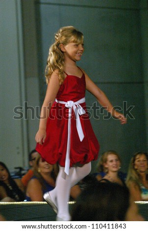 SAN DIEGO, CA - AUGUST 12: An unidentified child model walks the runway during the San Diego Bridal Bazaar at the San Diego Convention Center in San Diego, CA on August 12, 2012.