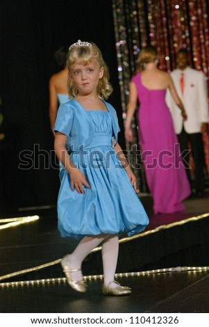 SAN DIEGO, CA - AUGUST 12: An unidentified child model walks the runway during the San Diego Bridal Bazaar at the San Diego Convention Center in San Diego, CA on August 12, 2012.
